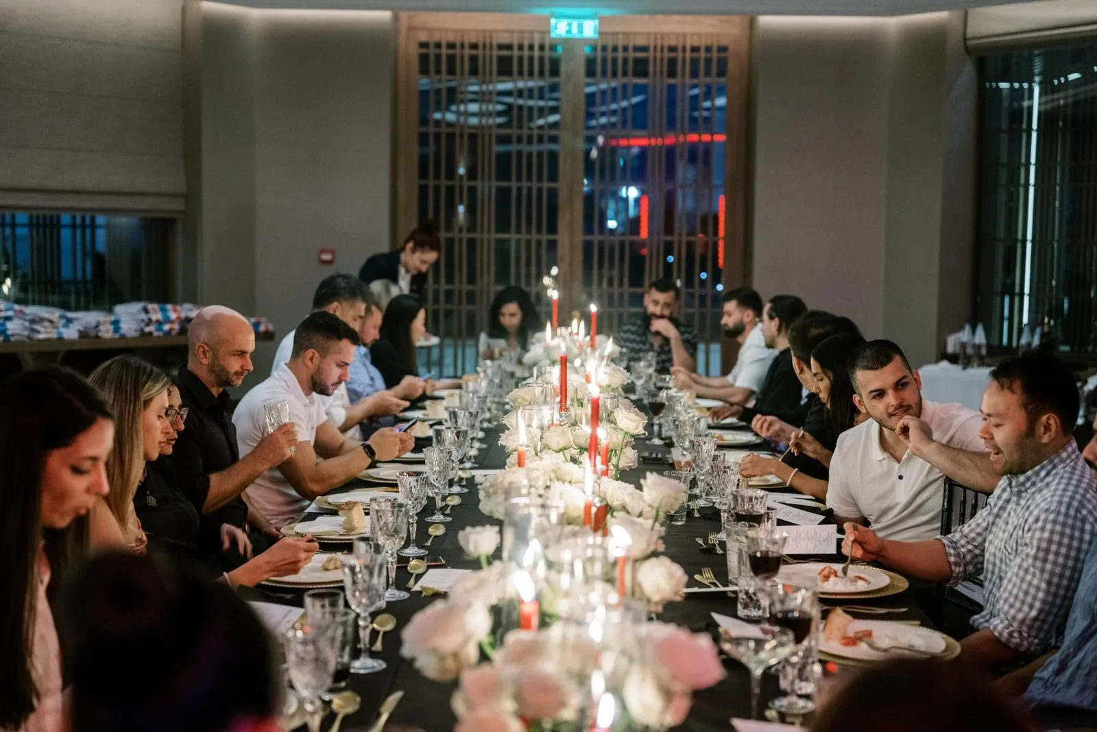 Long candlelit dinner table at the MaxWeb company retreat in Cyprus