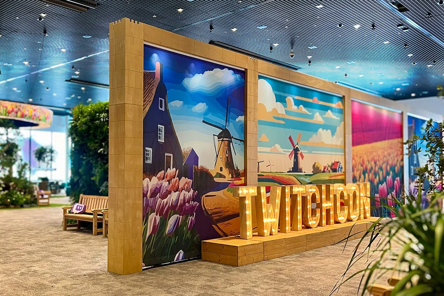 Branded conference booth in a large event hall at an international convention