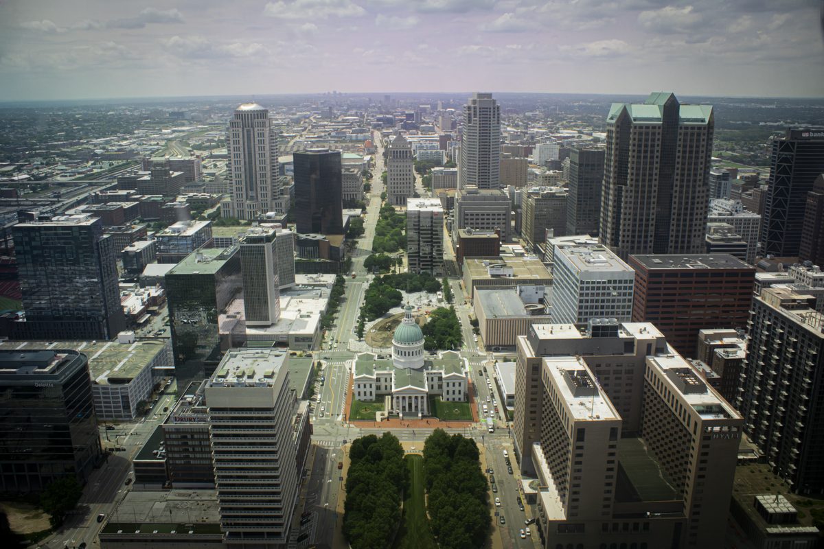 Downtown St. Louis streets and buildings seen from the Gateway Arch overlook.