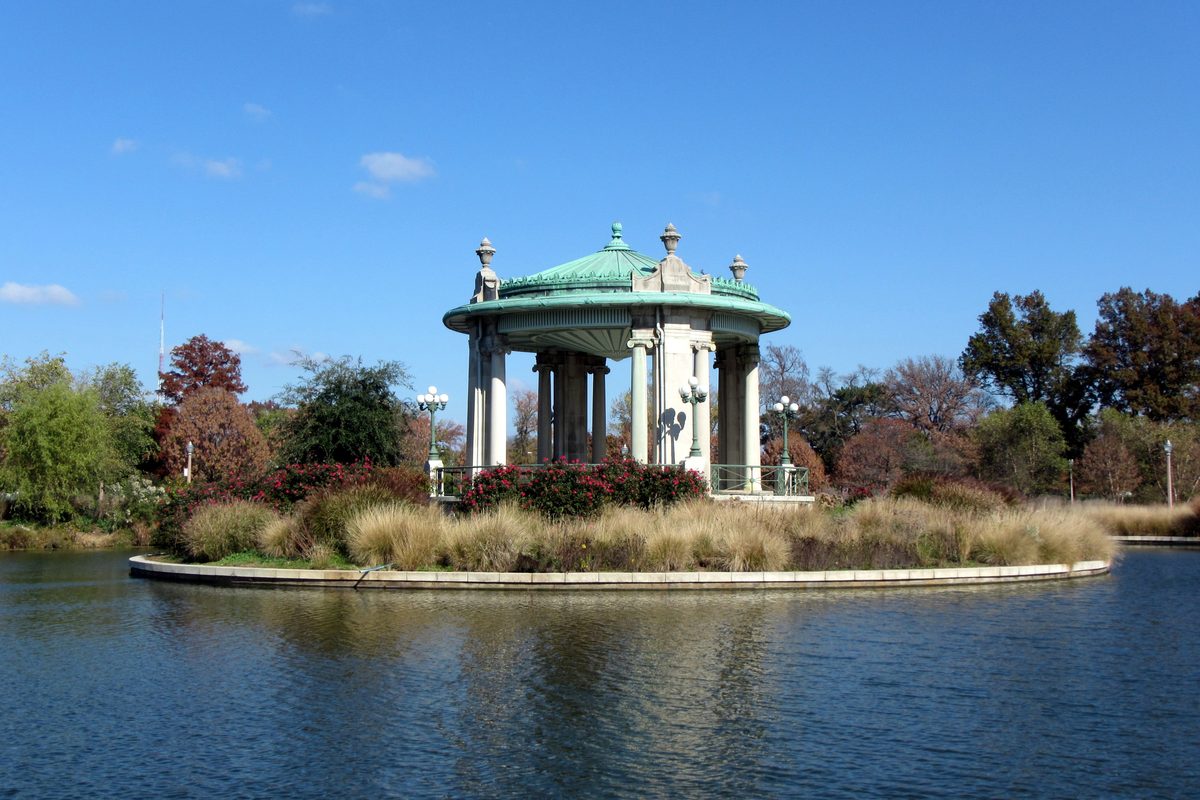 A domed pavilion on an island in a lake in Forest Park.