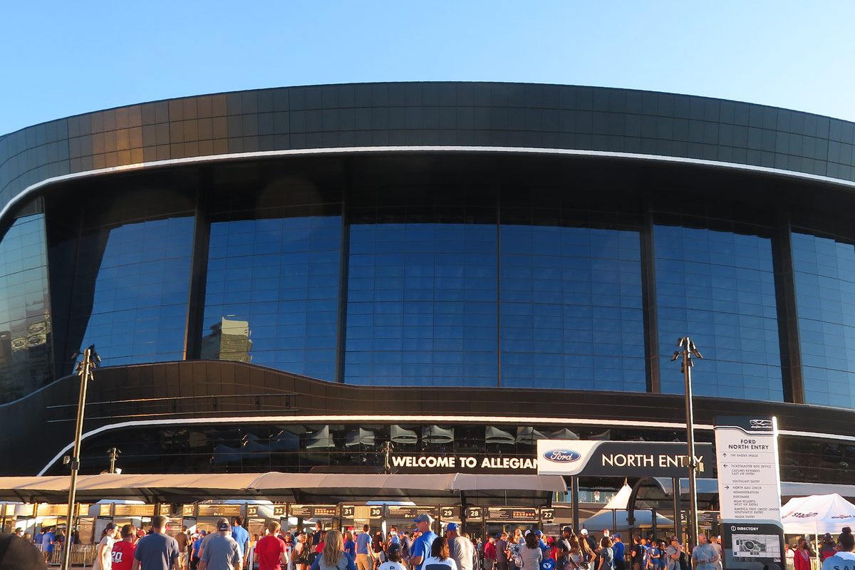 The exterior of Allegiant Stadium under a blue sky.
