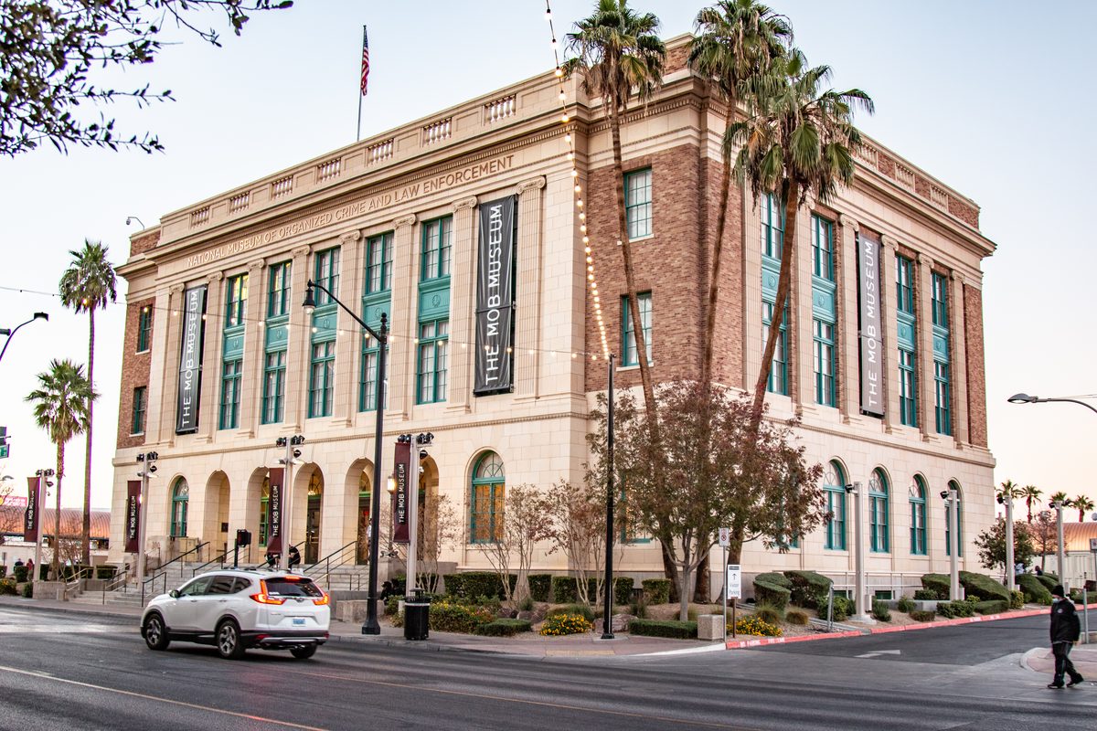 The Mob Museum in its historic former courthouse building, with palm trees in front.
