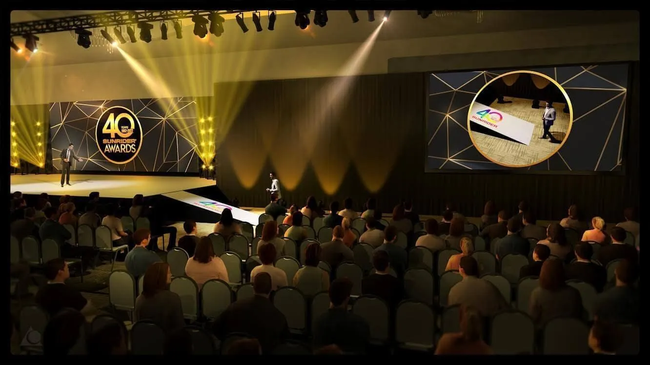 Anniversary stage show with lighting rig and a seated audience