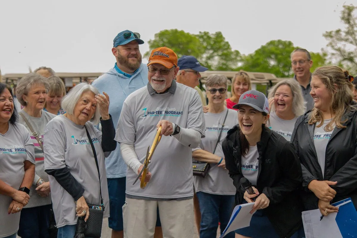 Group of people gathered outdoors at an event