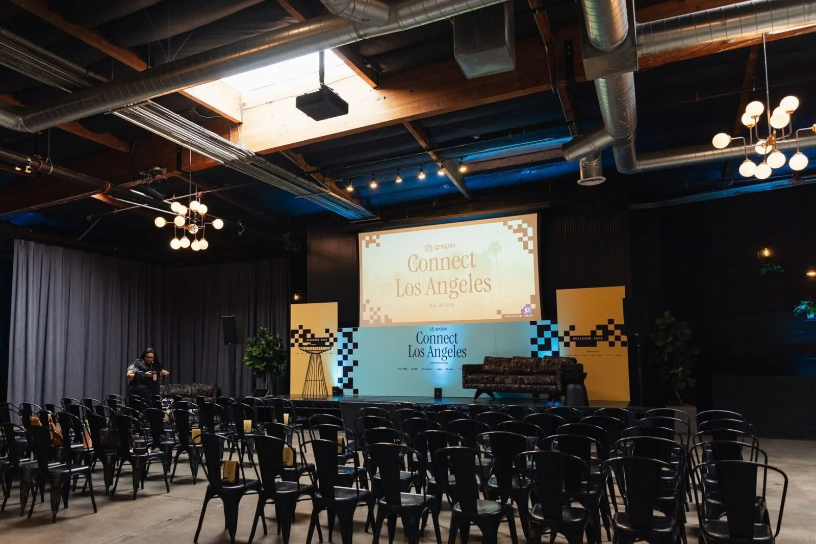 Stage and seating in an industrial venue for Gorgias Connect Los Angeles