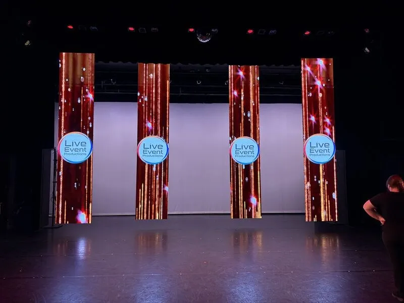 Stage with LED video columns showing the Live Event Productions logo
