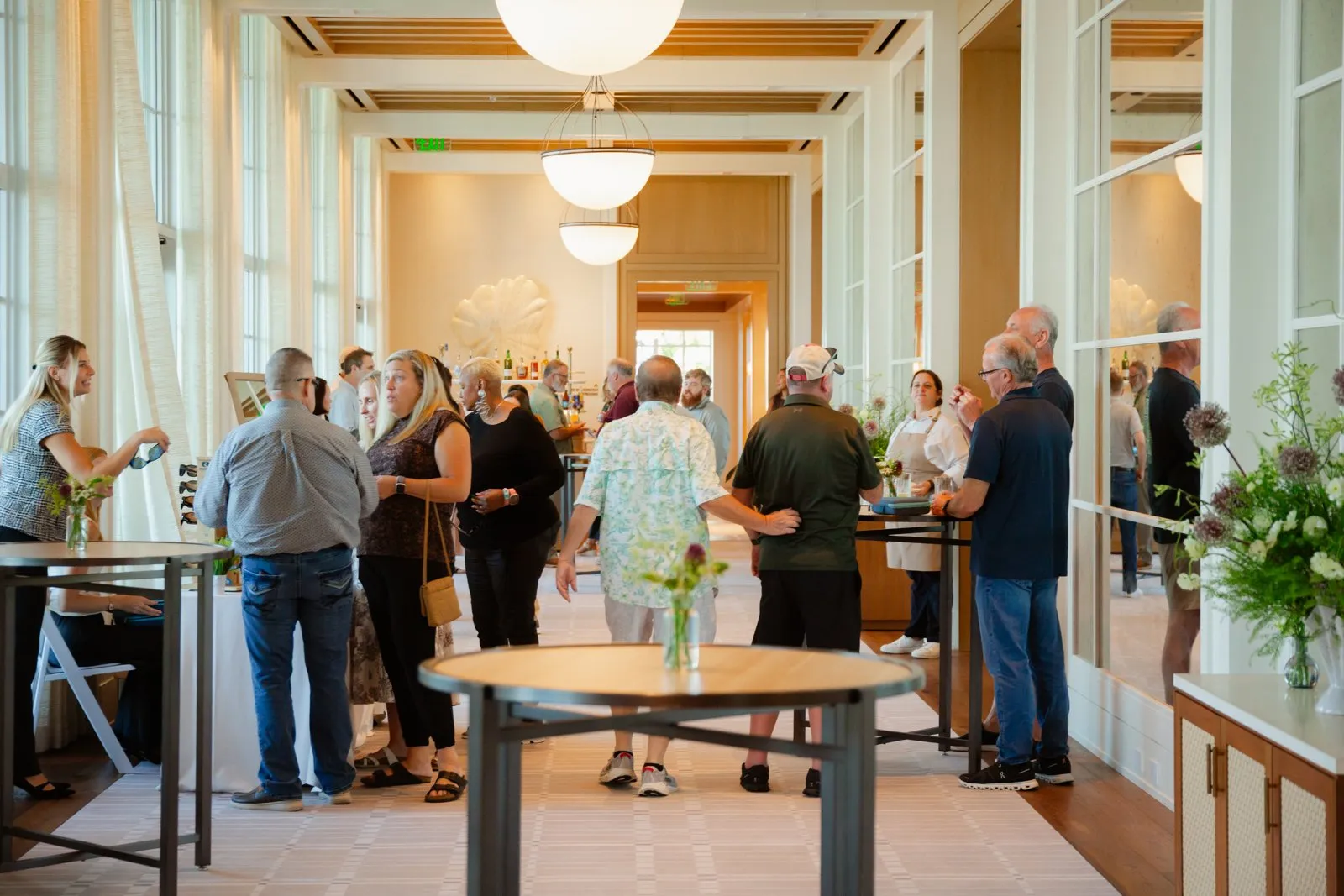Guests mingling at a reception during the Charleston retreat