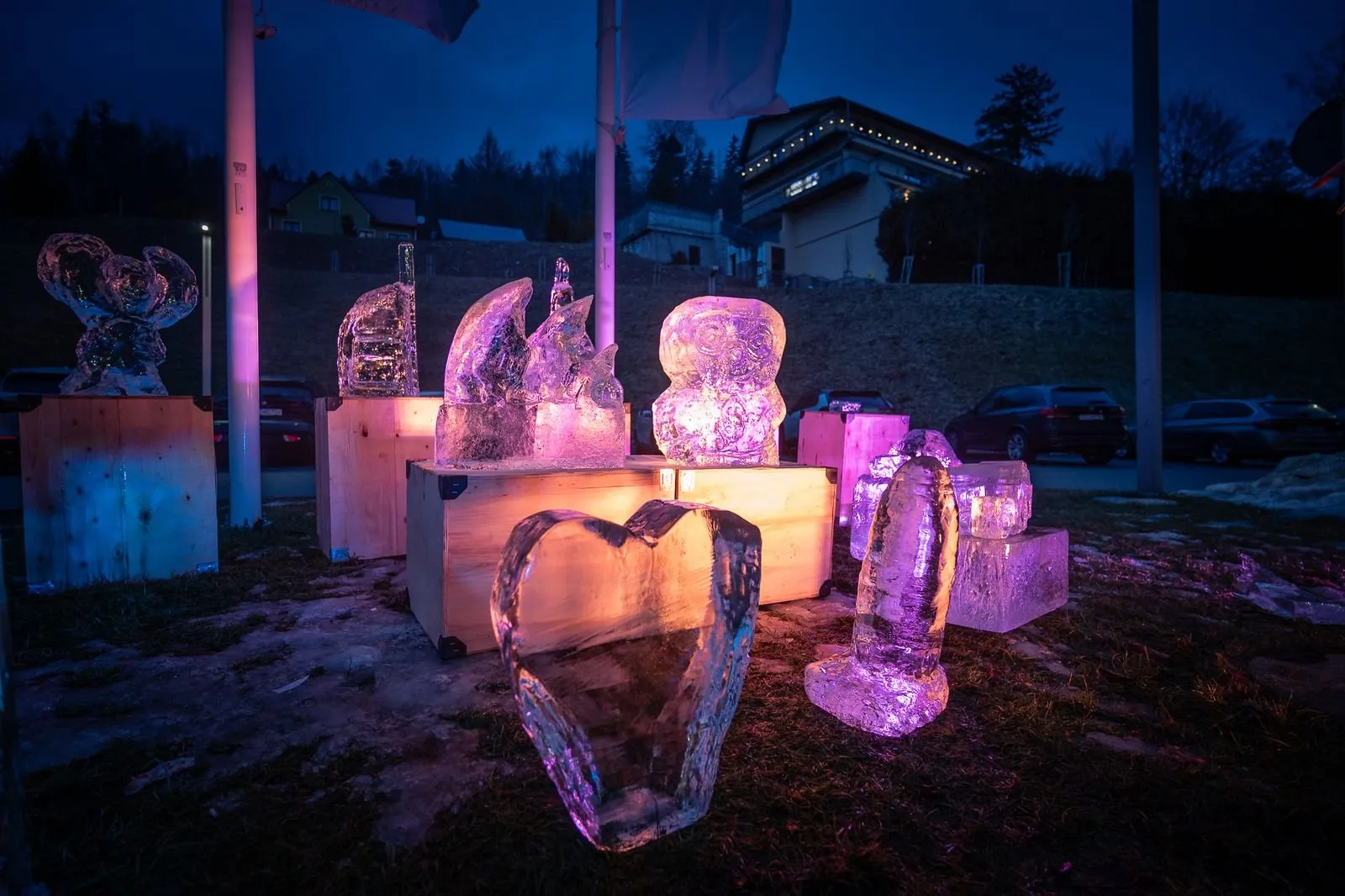 Illuminated ice sculptures outdoors at a winter company event