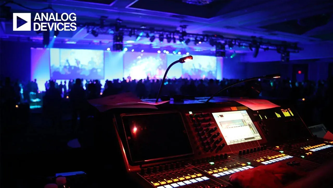 Production desk and stage lighting at a corporate conference