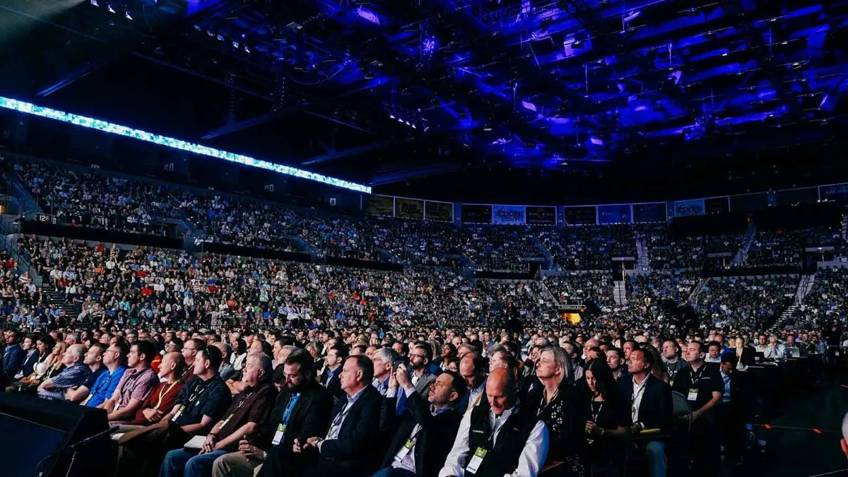 Arena filled with an audience at a large conference