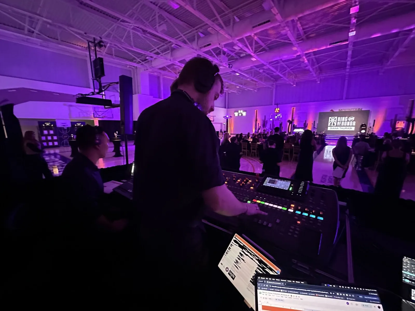 Audio engineer mixing at the front-of-house console during the Diana Taurasi dinner