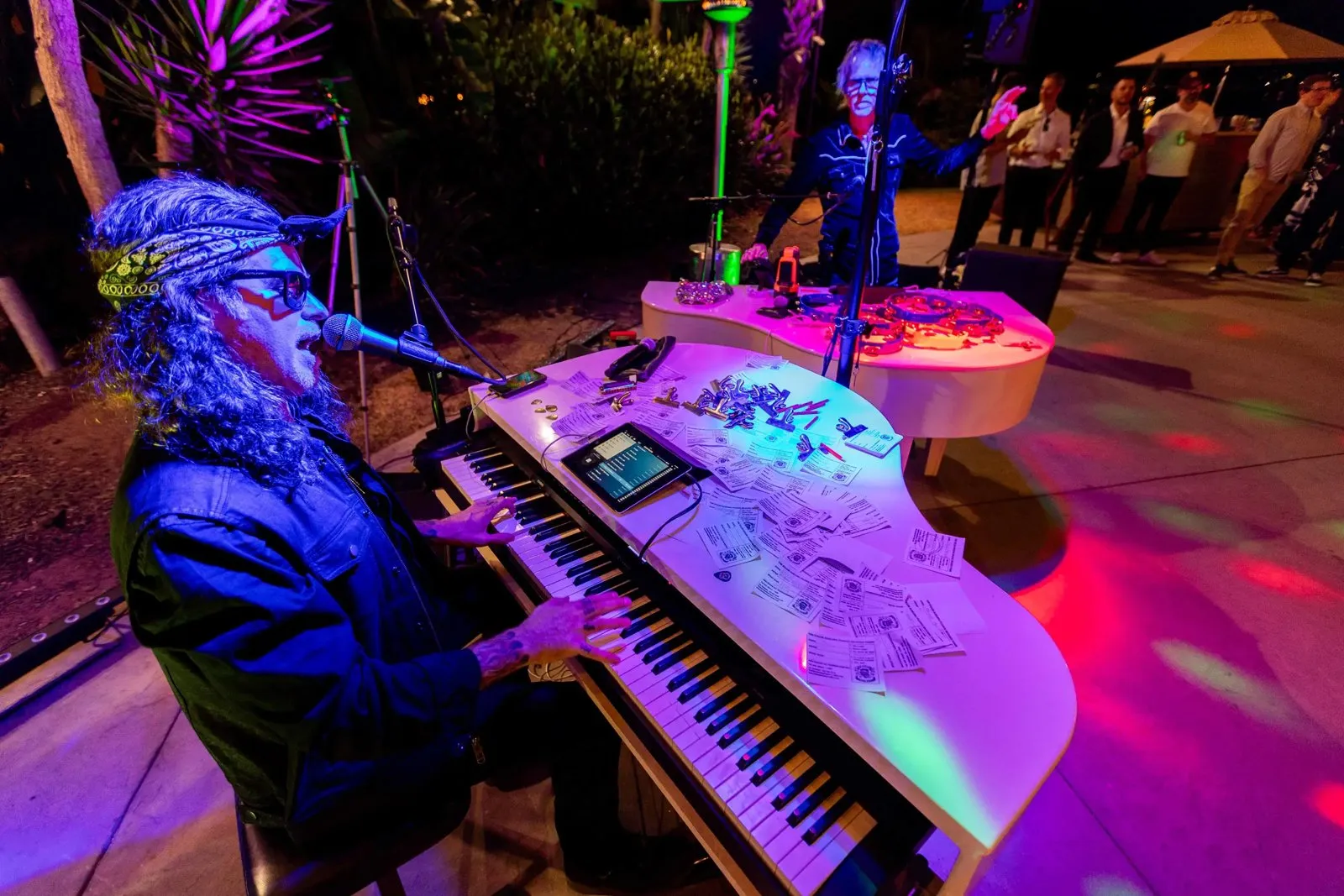 Dueling pianos performer at a themed party during the Seesaw retreat