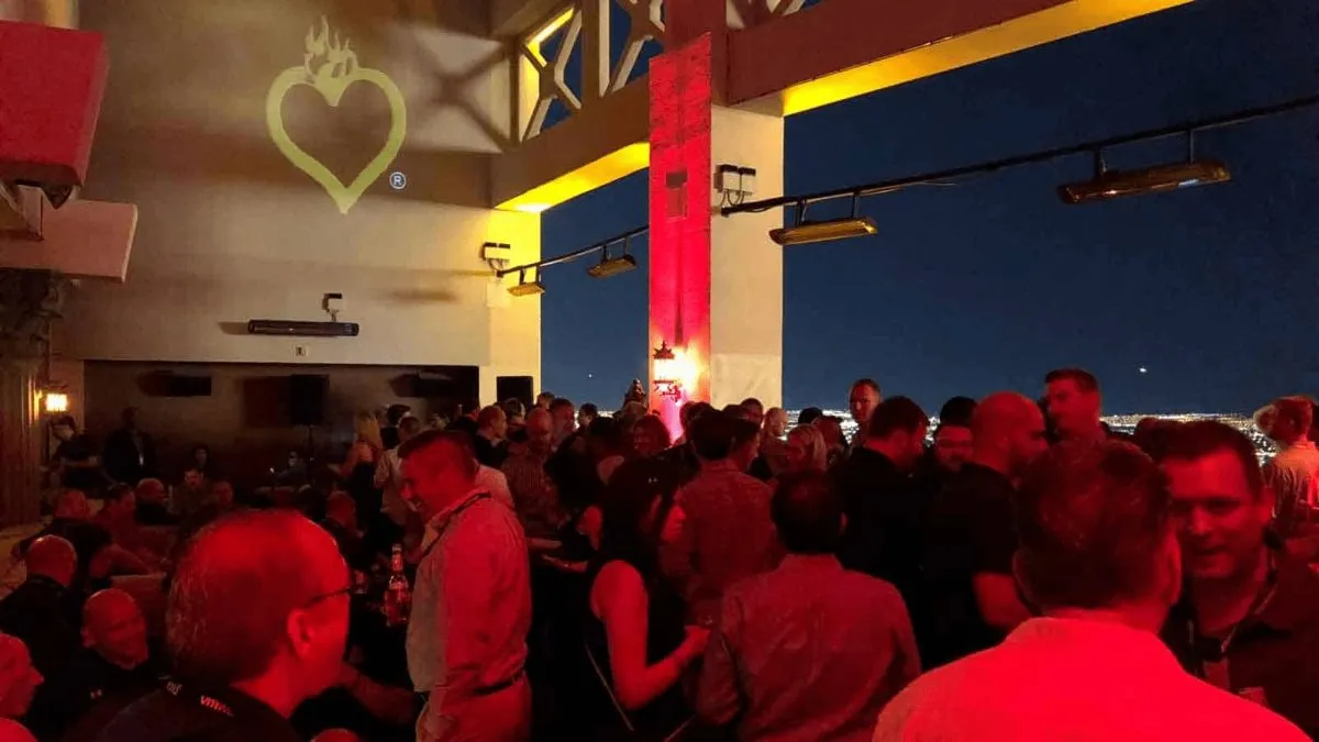 Crowd at a private party under red lighting