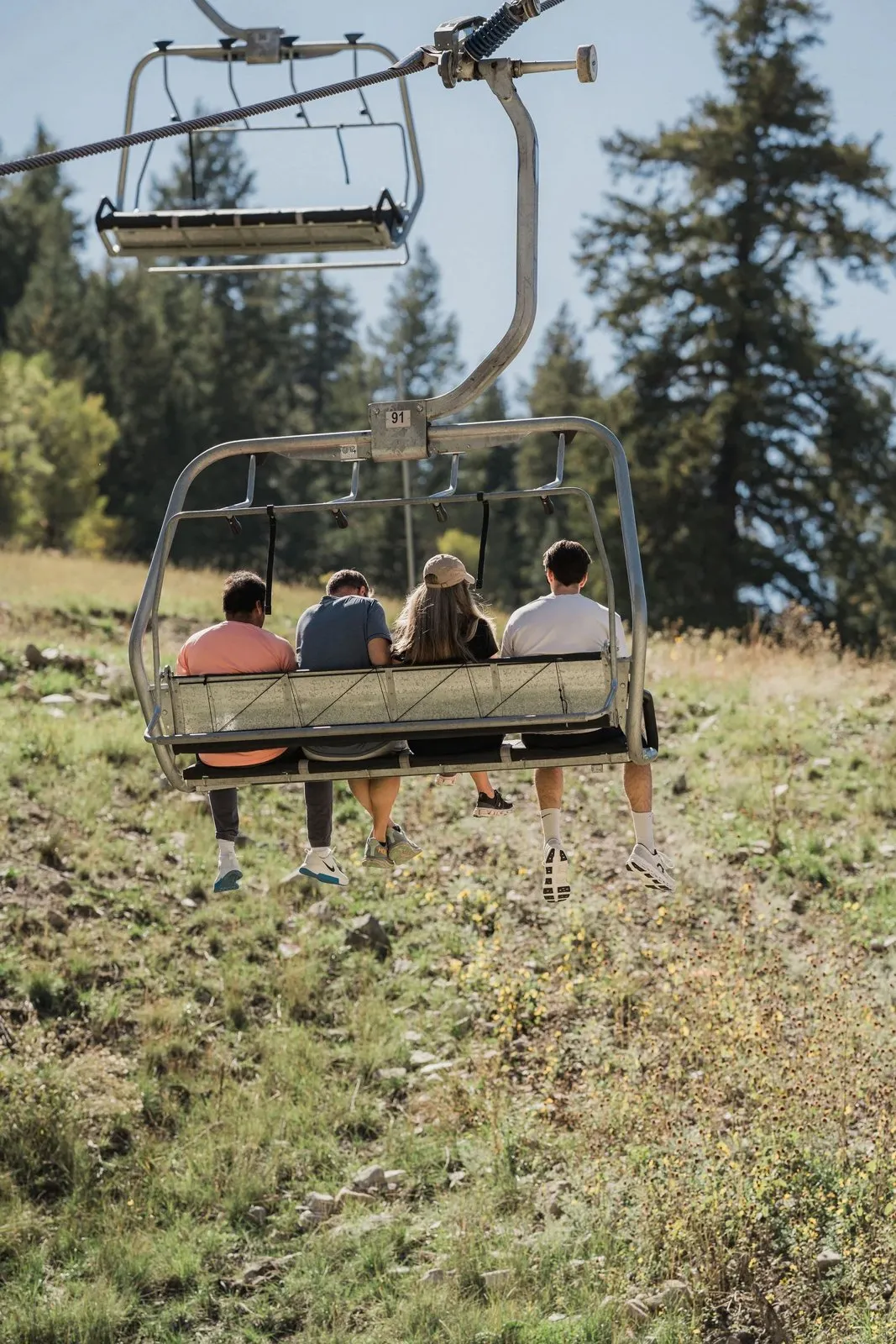 Chairlift ride through fall forest at Sundance during the Whitman Peterson retreat