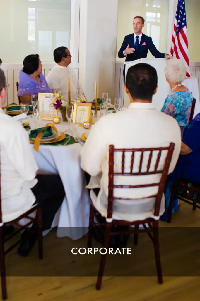 Speaker addressing guests at a corporate luncheon