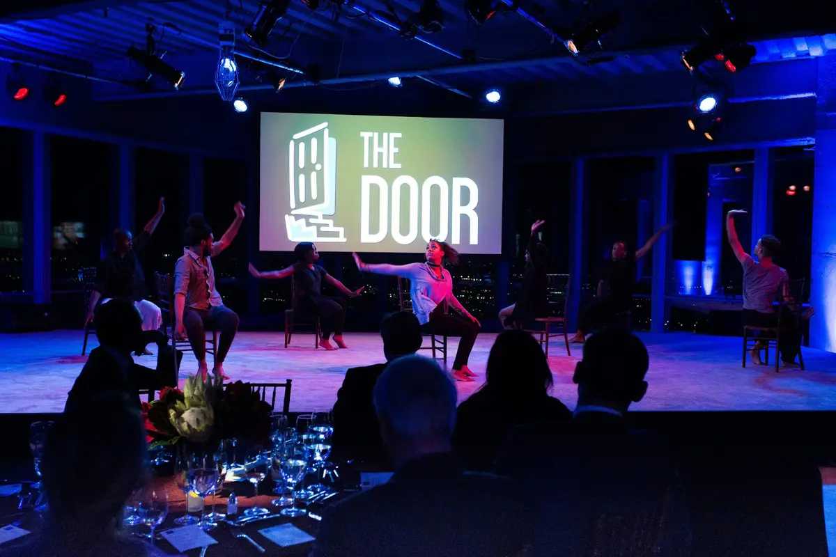 Performers on stage during an evening corporate event