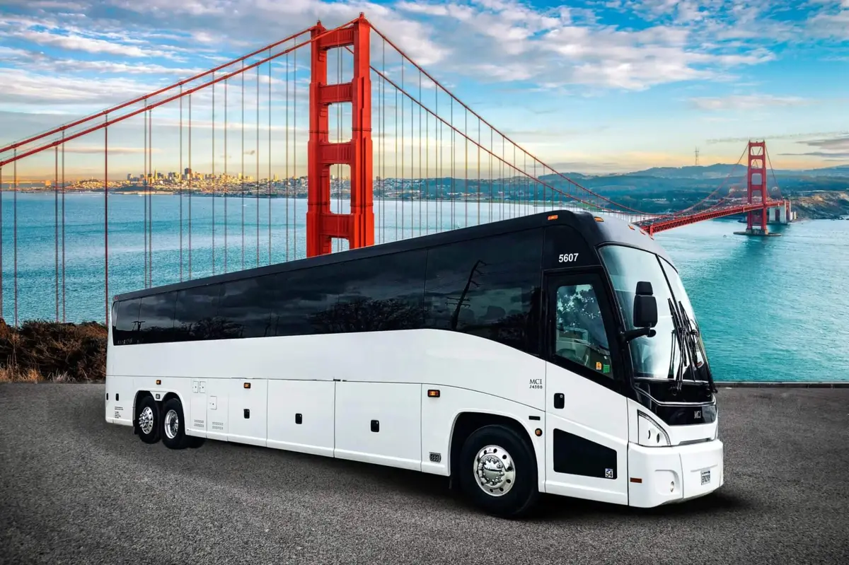A motorcoach in front of the Golden Gate Bridge
