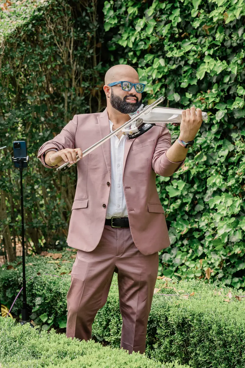 Violinist performing at the Hamptons Interactive Brunch