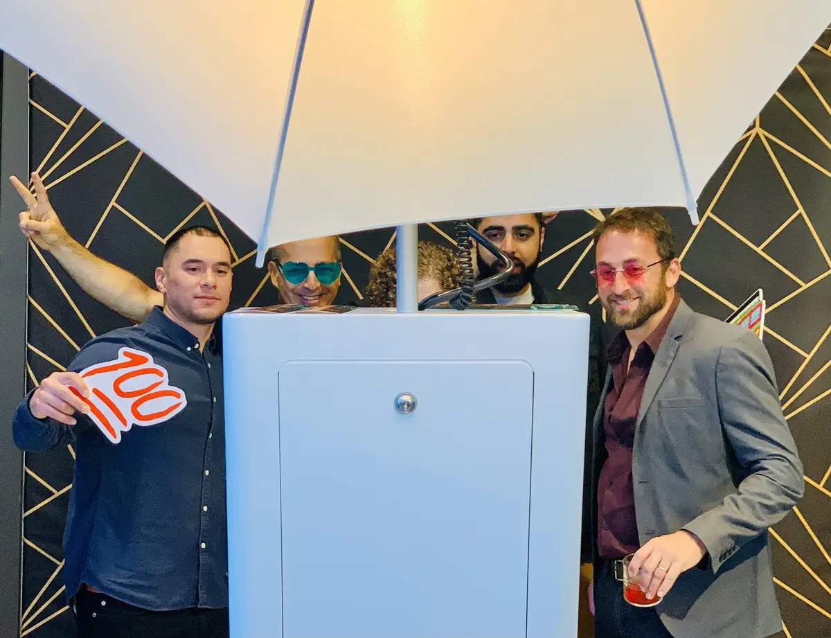 Guests posing at a photo booth