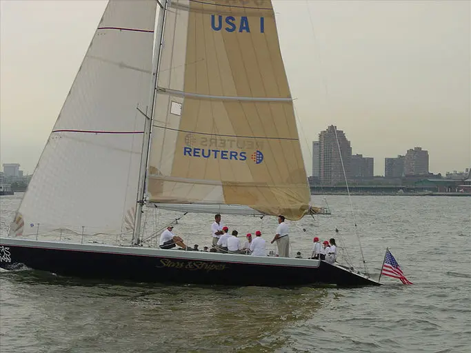 Corporate sailing team aboard the Stars & Stripes yacht with Reuters branding