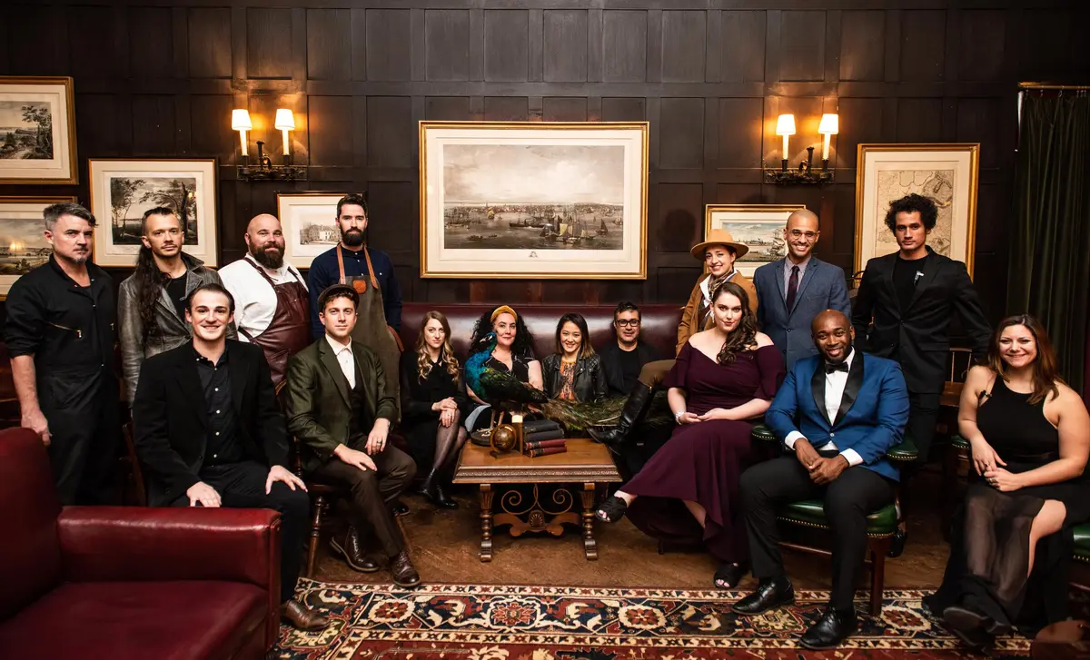 Guests in a wood-paneled room at The Macallan Manor