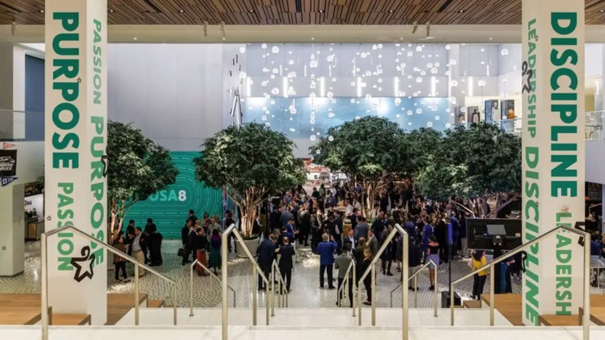 Large corporate event in an atrium with branded banners