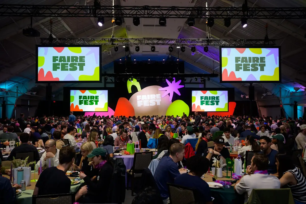 FaireFest company-wide retreat general session with branded screens