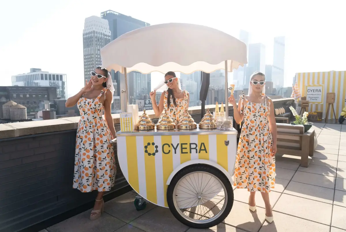 Rooftop cocktail party with branded dessert cart
