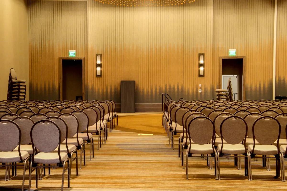 Rows of chairs arranged for an event in a hall