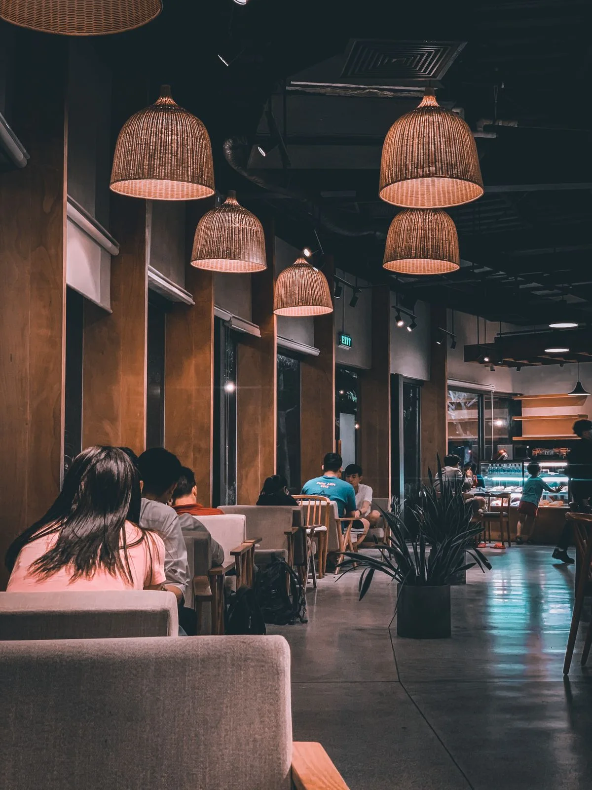 A restaurant dining area with tables and warm lighting