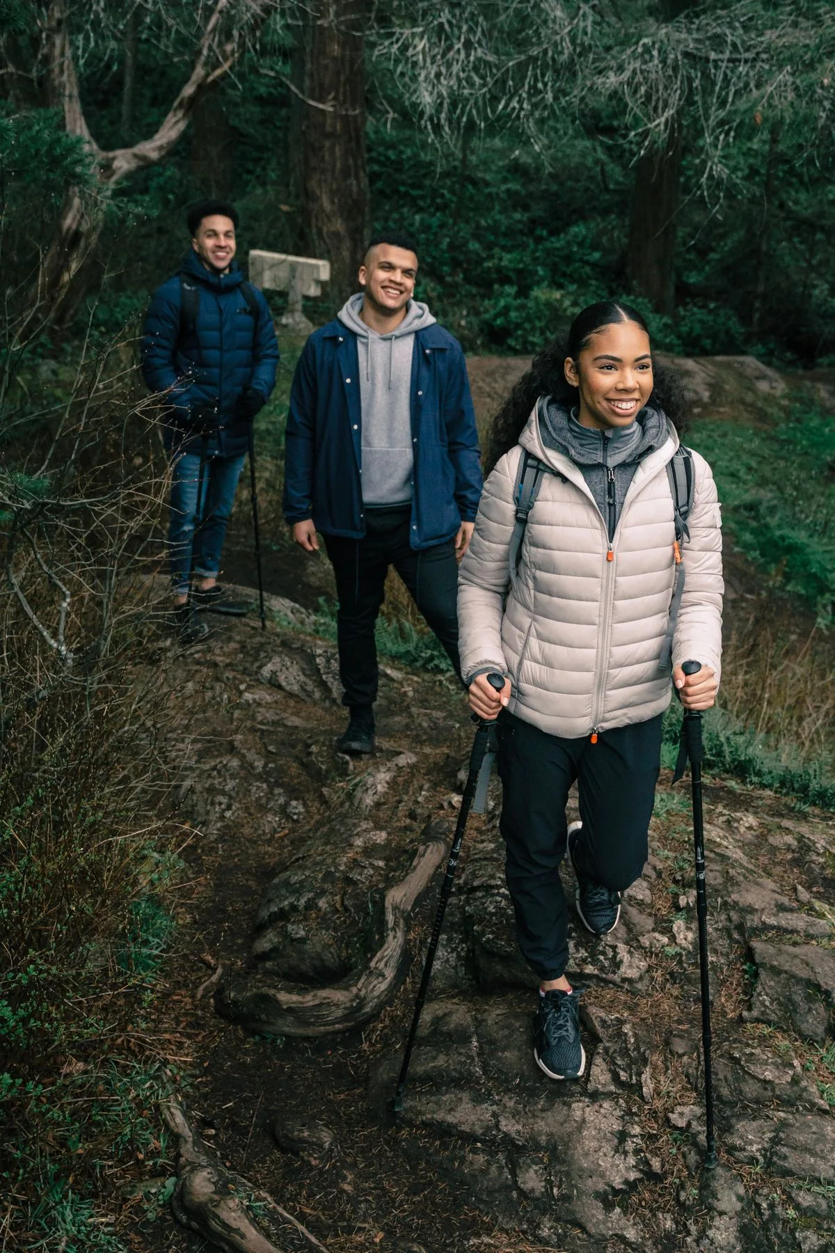 Friends walking together on a forest path