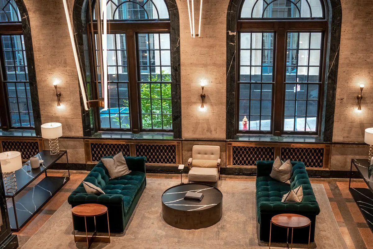 Hotel lounge with armchairs and large windows
